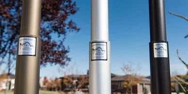 This image showcases three premium residential and commercial-grade flagpoles in bronze, silver, and black finishes—each proudly bearing the American-made label. These durable, high-quality flagpoles are built to withstand Ohio weather while adding a polished, patriotic look to any home or business. At Western Reserve Flag & Sports in Boardman, Ohio, we offer a full selection of aluminum flagpoles with expert installation services throughout Mahoning, Trumbull, and Columbiana Counties, including Youngstown, Canfield, Poland, and beyond.