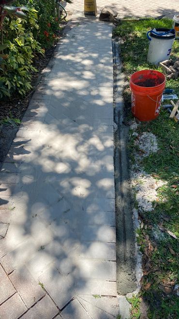 Rebarb repair of paver support wall.