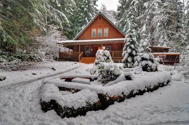 Henry Creek Cabin covered in winter snow