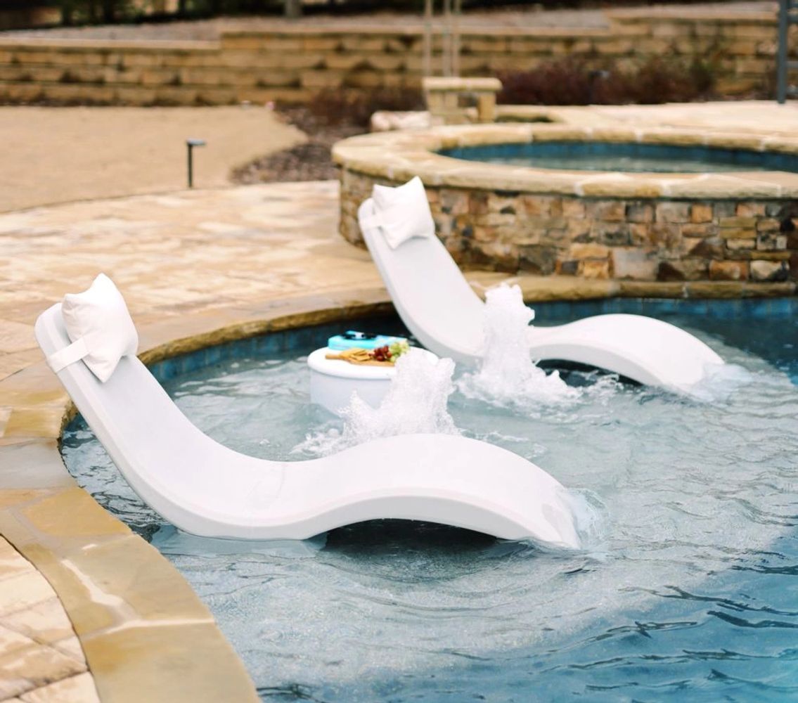 Picture of Pool Loungers in White on Pool Shelf with in-pool table.