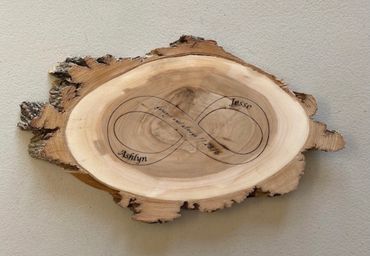Infinity Symbol engraved on Willow wood slice with your names, date and quote.