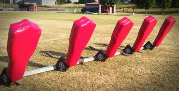 Football practice dummy covers in red