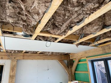 Insulate and plasterboarding a ceiling