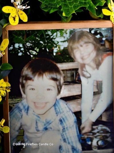 My baby brother Christoher and I chasing fireflies in our back yard with Grandpa.