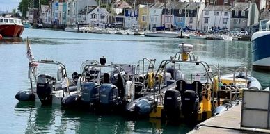 Group of 3 powerboats in Weymouth harbour