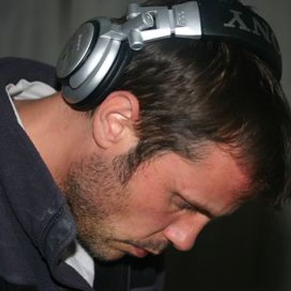 Man wearing large headphones focused intently.