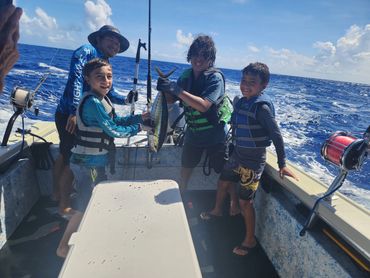 The boys with a nice Yellowfin Tuna!