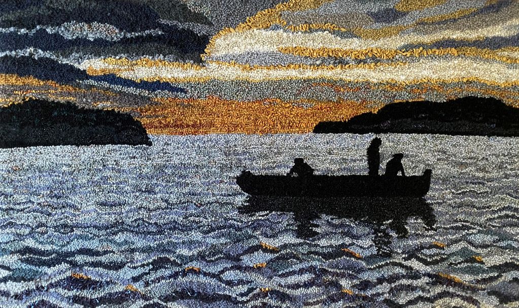 People in a boat fishing in a bay