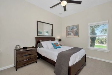 West secondary bedroom with a trundle twin-size bed underneath it.
