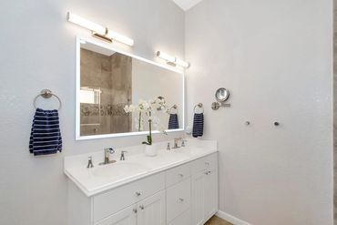 East primary bathroom with dimmable and heated make-up mirror.