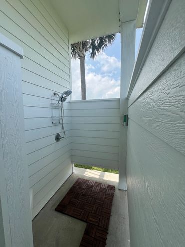 Rise of all the sand after the beach or just your feet in the outdoor shower.