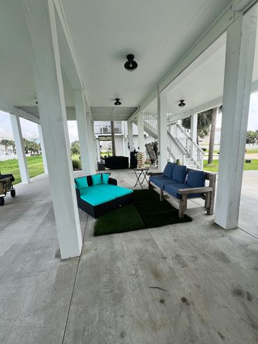 Lounge chairs and couch to watch tv with dinner is being prepared.