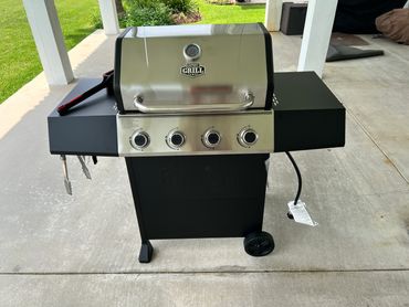 Four burner gas grill.
