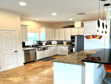 Great kitchen with lots of counters to prep all your meals.