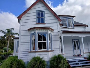 White character home in Kauri with detailed timber trim around the bay window