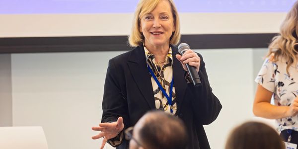 Woman speaking into a microphone,