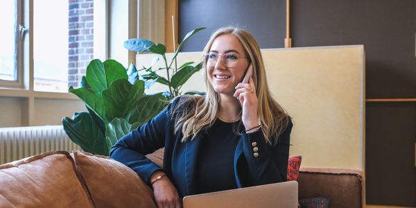 Picture of a smiling woman on the phone