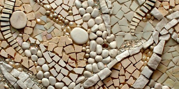  mosaic art piece made with neutral colors. The mosaic is made of stone, glass, beads, mirror, tile
