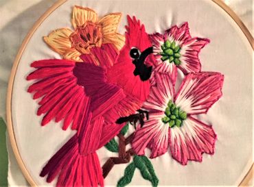 embroidery of cardinal, daffodil and dogwood blossoms