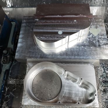 Milled part from an aluminum block in two stages