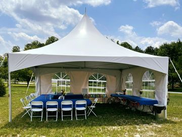 20x20 frame tent with banquet tables, white folding chairs, cloth linens. Backyard Graduation Party