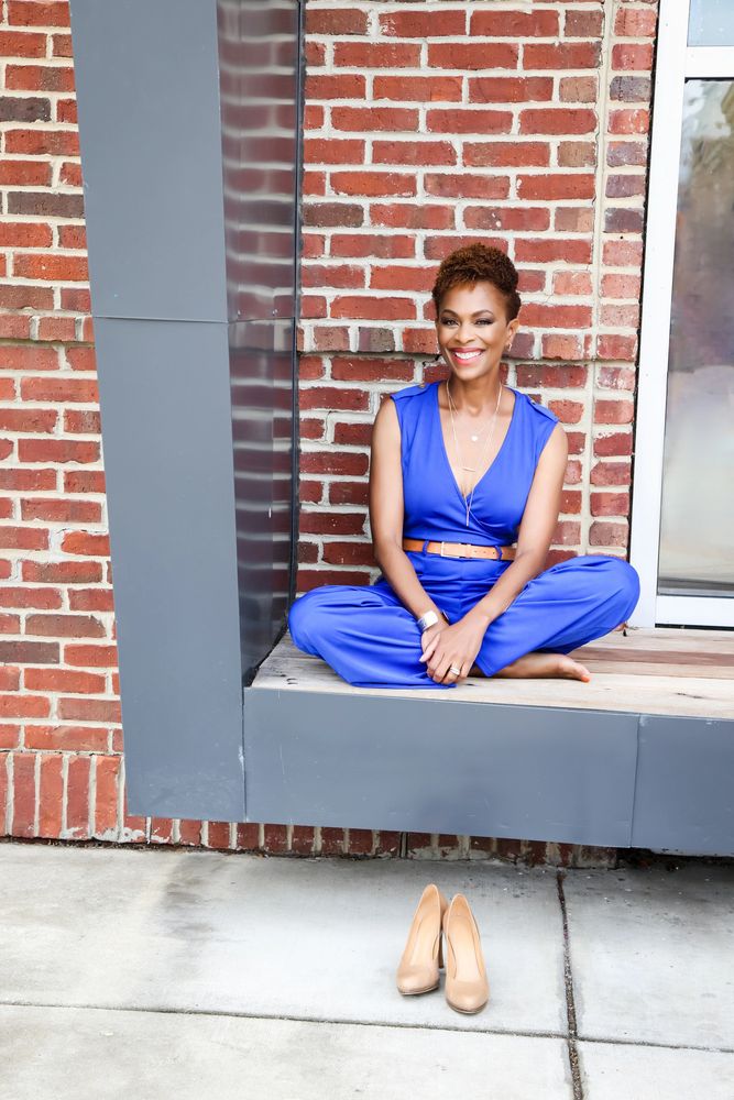 Valonda Calloway sitting with her shoes below her.