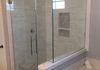 Custom Frameless Shower Door with Step up and 90 Degree Return with a Ladder Pull Handle