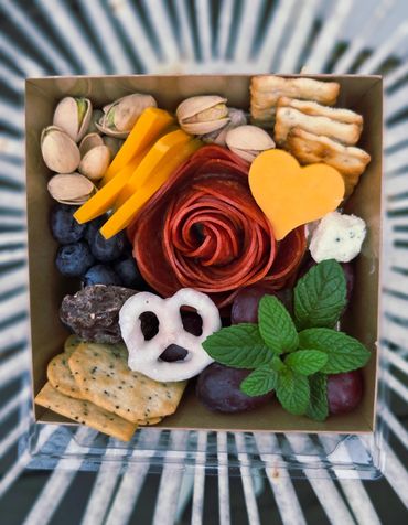4 x 5 inch box filled with tasty valentine's themed charcuterie