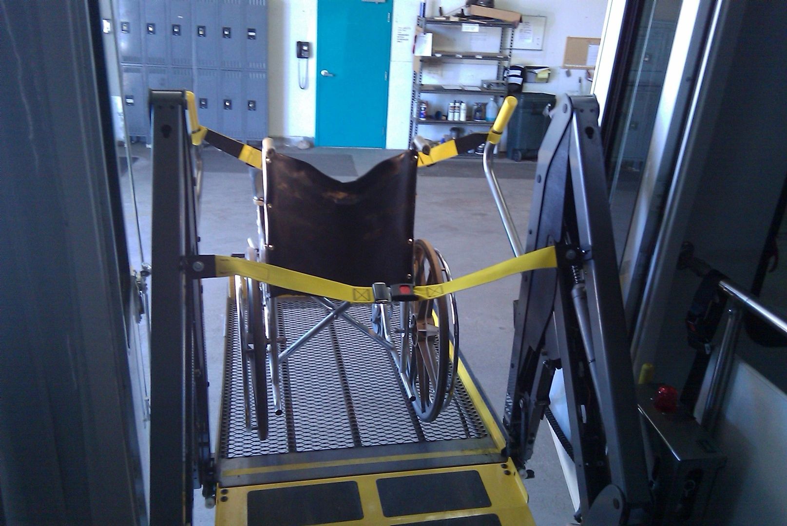 A wheelchair with a yellow belt
