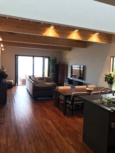 Living room with folding doors leading to pool area