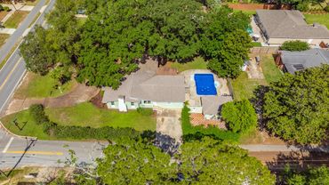 Drone photo from Berry Avenue of the one of a kind Berry House in Gulf Breeze Proper.