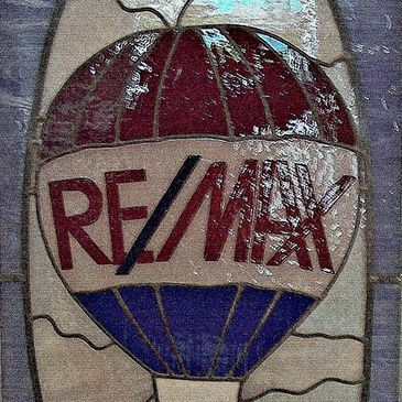 Stained glass door insert for Re/Max office in Lewisville, Texas.