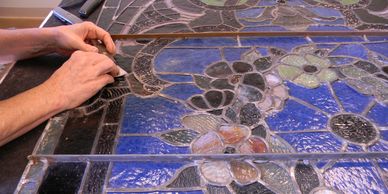 Art Glass Ensembles repairs stained glass windows too.
