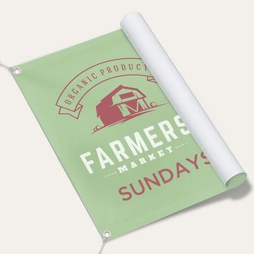 Green banner promoting a Sunday farmers market with organic products.