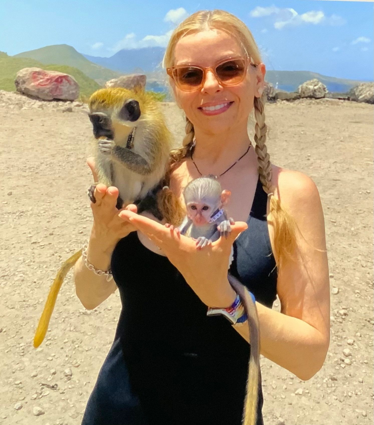 GraceAnn Stewart in St. Kitts holding monkeys!
