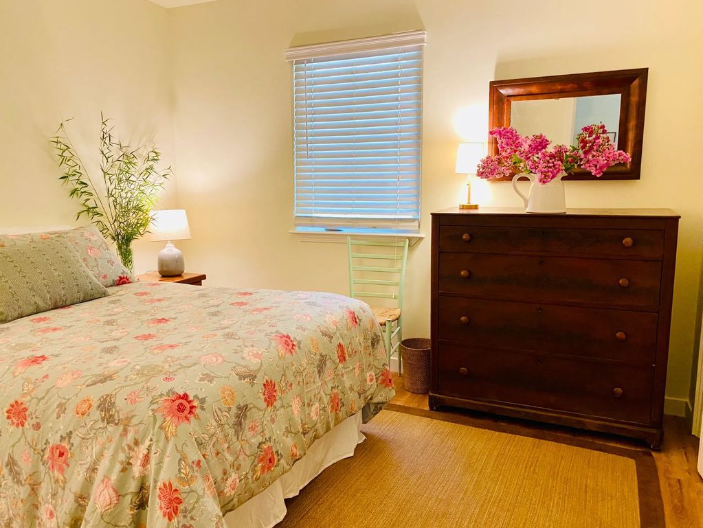 A cozy bedroom with shared bath.