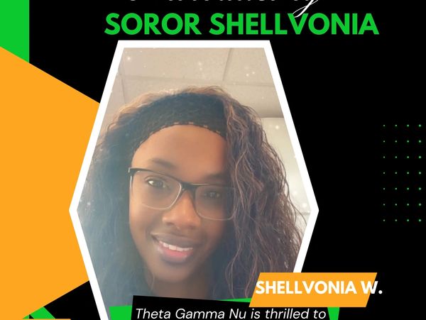 Portrait of Soror Shellvonia with a welcoming smile and glasses.