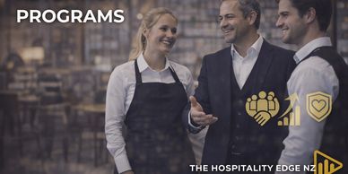 Three hospitality workers discussing programs with icons.