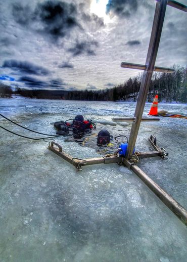 Our divers ascending from under the ice
