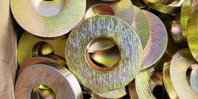 Close-up of shiny metallic washers with a textured surface.