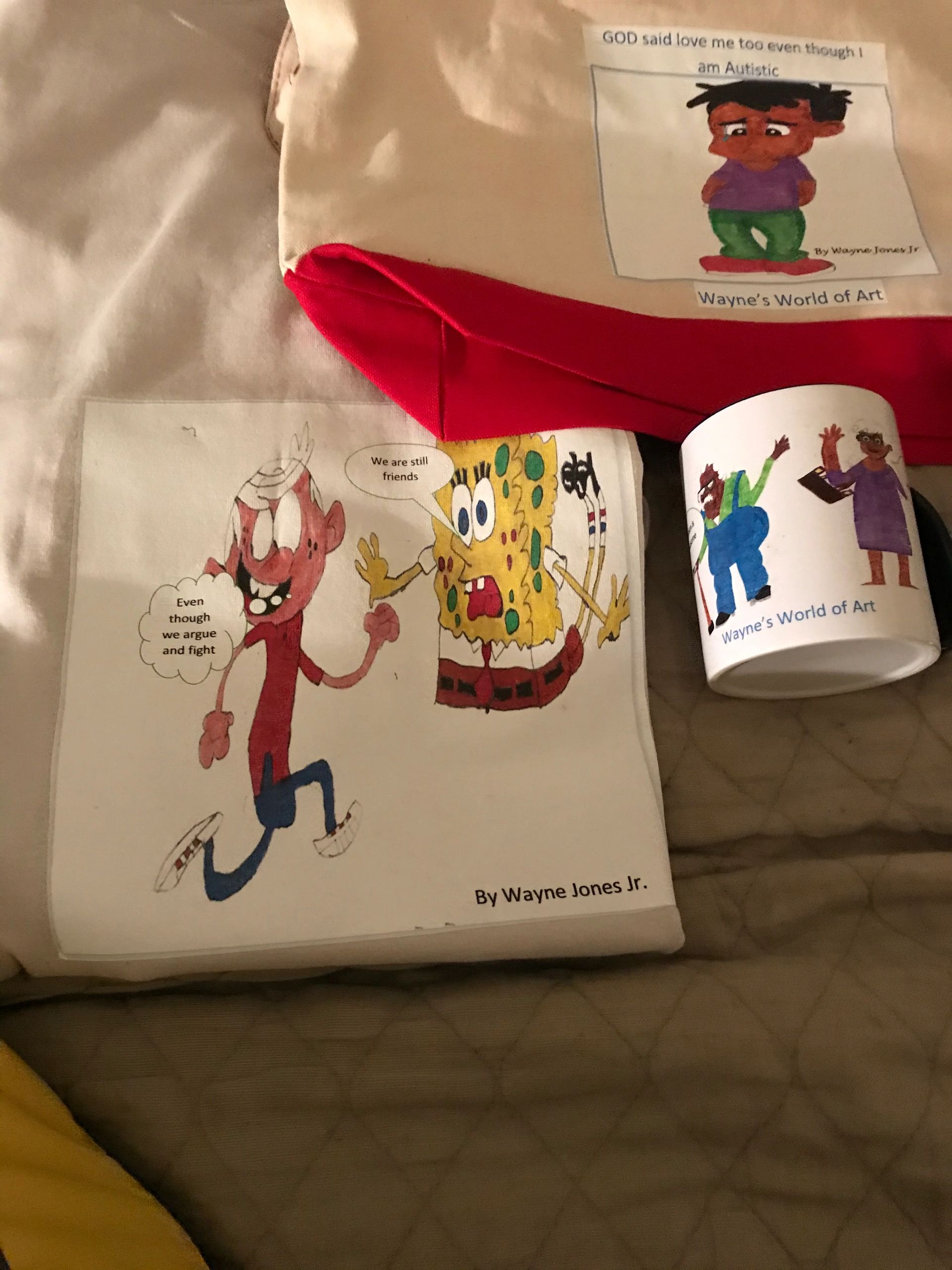 Coffee mugs , shoulder bags , t-shirts and water bottles with cartoon characters drawn by a child w