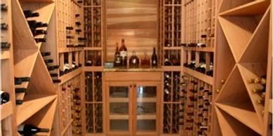 Elegant wooden wine cellar with organized racks and bottles.