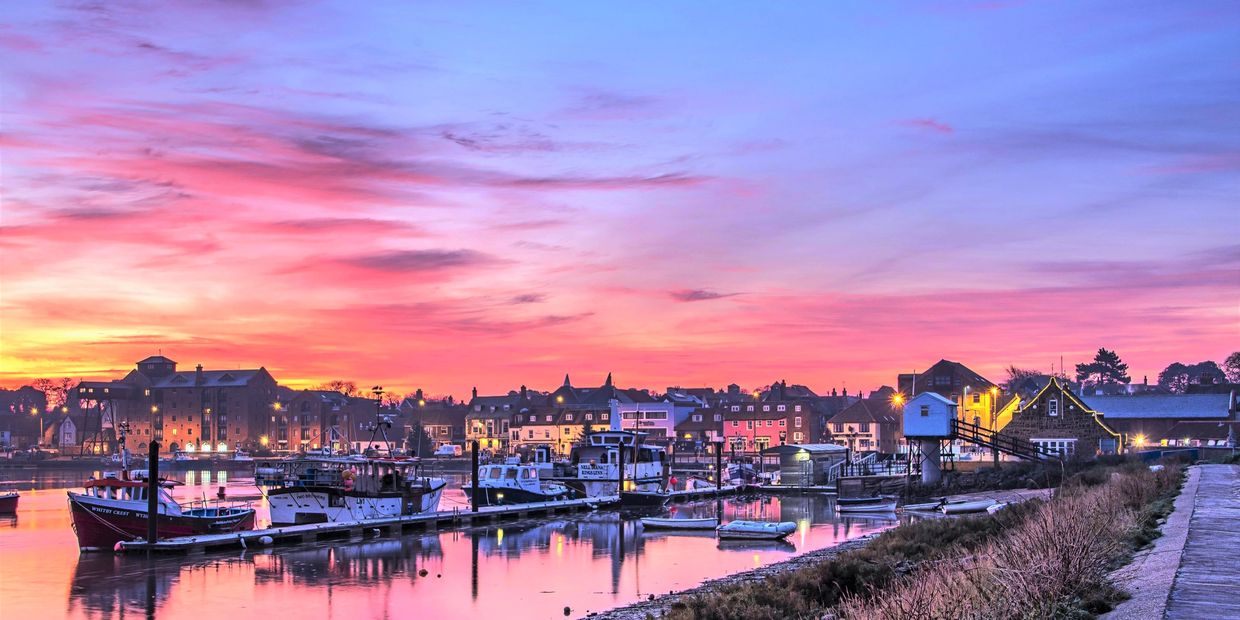 Beautiful Pink, purple, blue and orange sunset over Wells harbour. Image credit: Reg Holl.