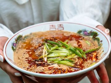sesame-forward broth, tahini miso tare, our spicy oil and the subtle heat of Sichuan pepper.