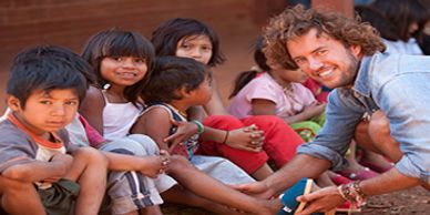 TOMS Founder Blake Mycoskie gives to needy