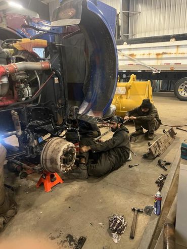 mechanics repairing truck