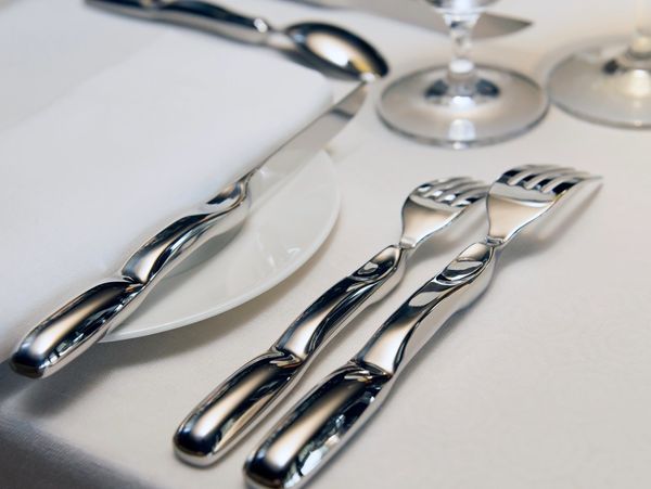 Stainless steel cutlery, design to hold correct while eating correctly according to etiquette