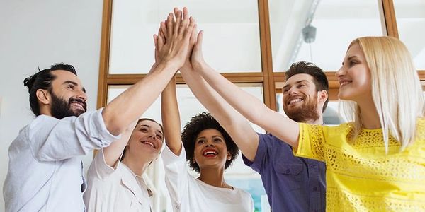 Diverse team giving each other a high-five