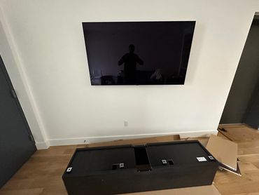 TV wall mount and floating island on wooden breams Williamsburg Brooklyn