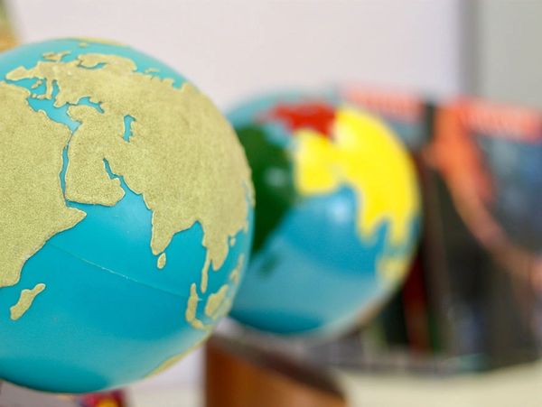 Close-up of two globes showing continents.